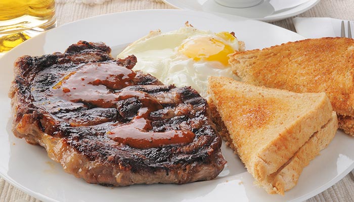 Grilled steak with sauce, egg, and toasted bread—perfect Lunch & Dinner at our Tooele Utah restaurant.