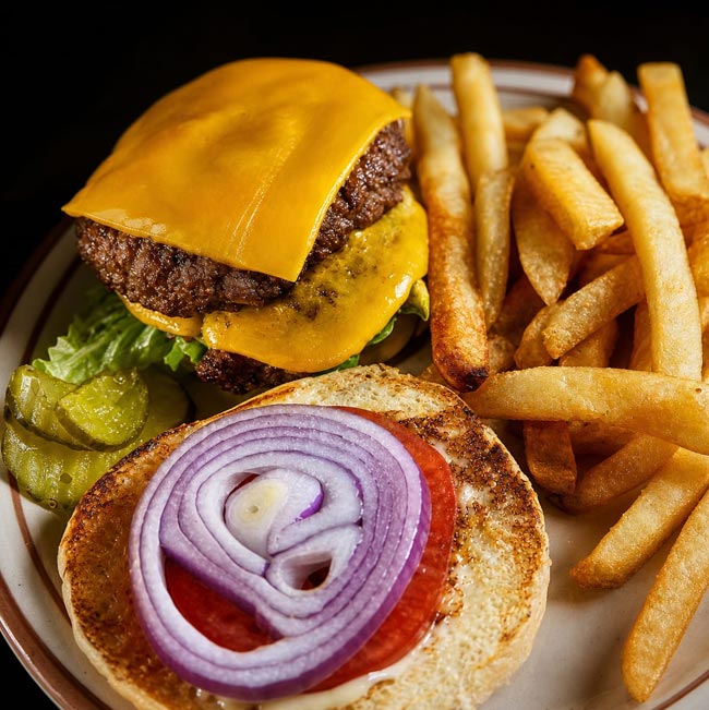 About Spiro’s All Day Diner: Cheeseburger with lettuce, tomato, pickles, onion, and fries.