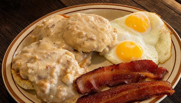 Biscuits with gravy, eggs, and crispy bacon—your classic Breakfast Menu in Tooele, UT.