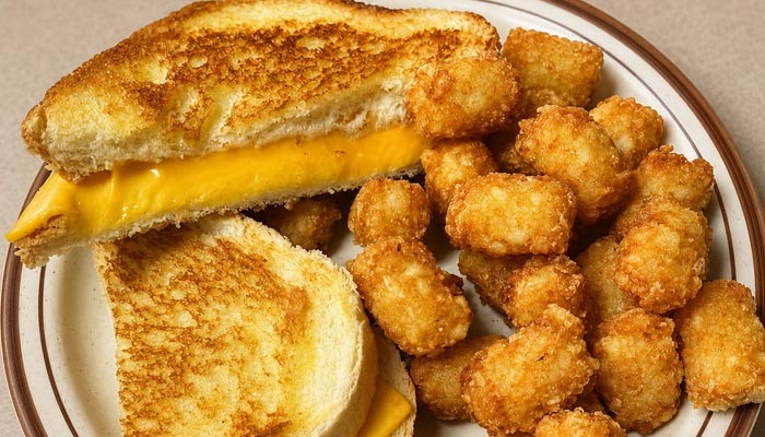 Grilled cheese sandwich with melted cheese, crispy tater tots—Lunch and Dinner Menu Tooele UT.