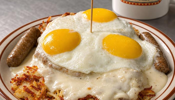 Breakfast Menu Tooele UT: Three sunny-side-up eggs, gravy, hash browns, sausage, and sweet syrup.